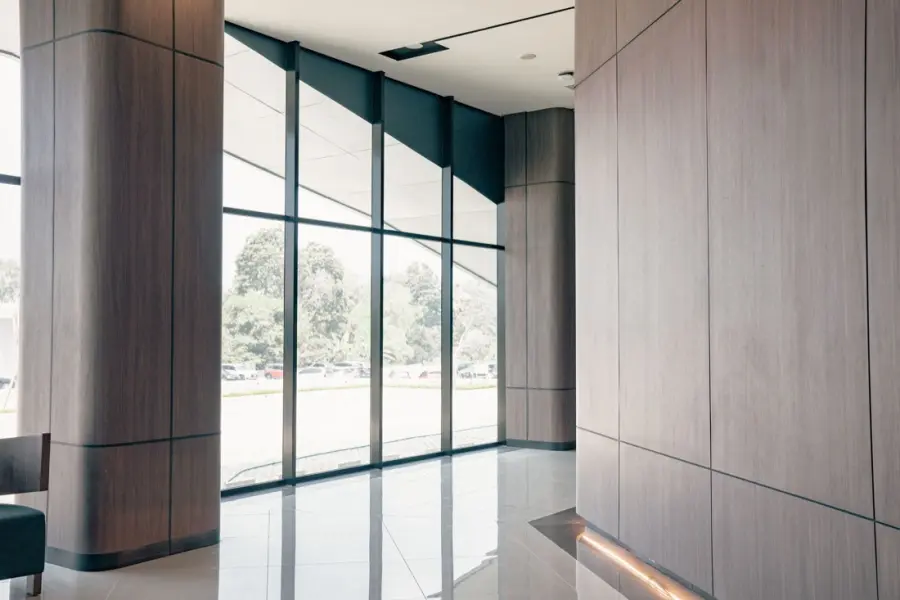 Bright, private office lobby with tall windows